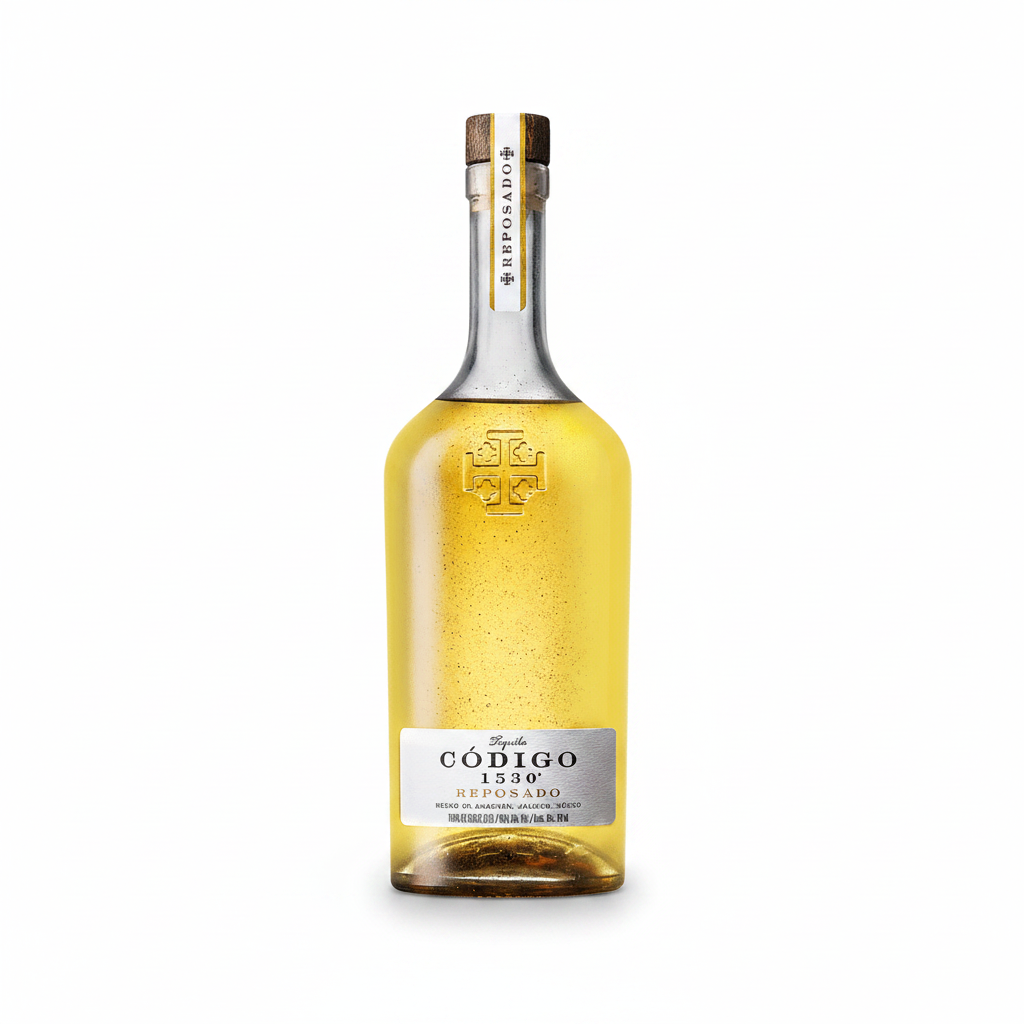 A bottle of Código 1530 Reposado tequila with a gold and white label, set against a solid dark green background.