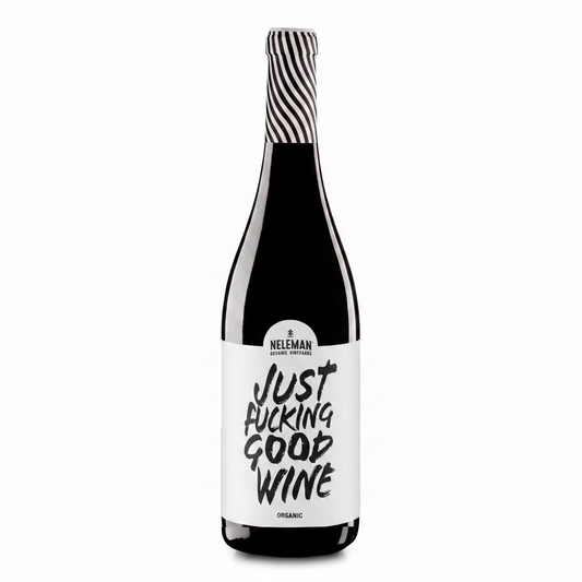 A bottle of Neleman Organic Red Wine with a bold white label reading 'JUST FUCKING GOOD WINE' in black lettering, topped with a black and white striped foil, set against a solid peach background.