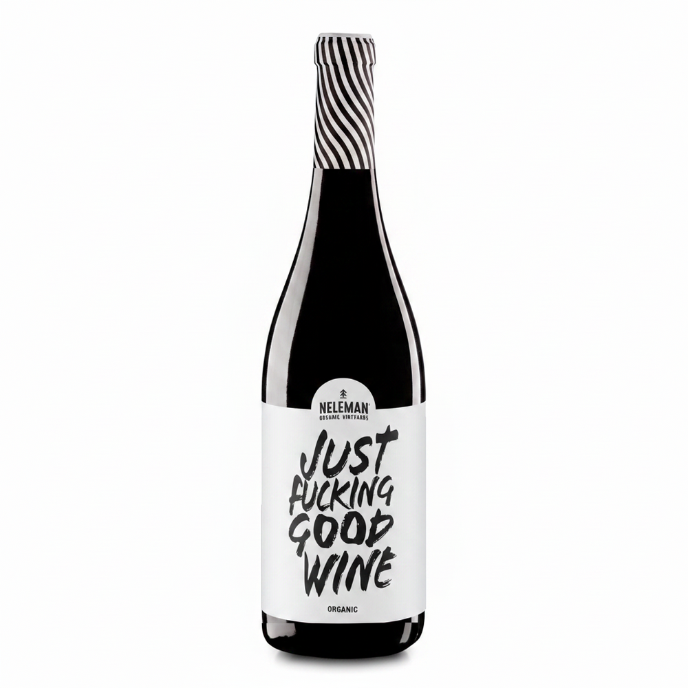 A bottle of Neleman Organic Red Wine with a bold white label reading 'JUST FUCKING GOOD WINE' in black lettering, topped with a black and white striped foil, set against a solid peach background.